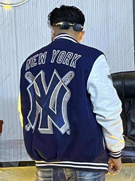 Men's New York Yankees navy mash-up varsity jacket with wool body, leather sleeves, and embroidered team patches.