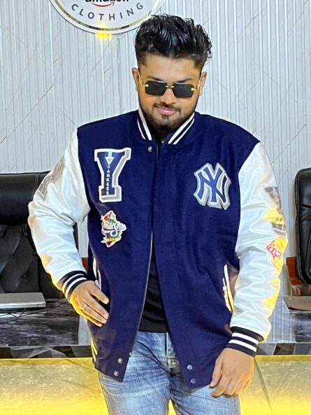 Men's New York Yankees navy mash-up varsity jacket with wool body, leather sleeves, and embroidered team patches.
