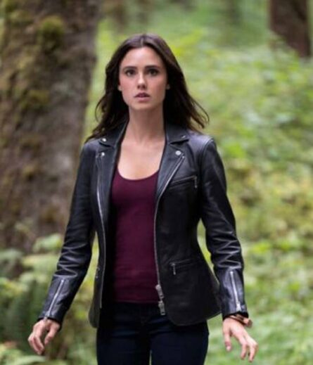 "A sleek black genuine leather jacket with zippered cuffs, inspired by Poppy Drayton’s style from Charmed. Features a fitted silhouette, smooth front zipper closure, and adjustable wrist detailing for an edgy yet sophisticated look."