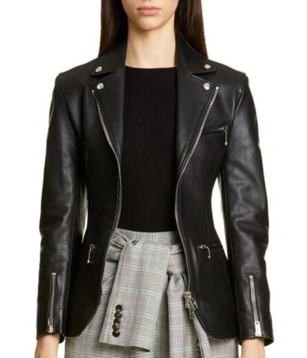 "A sleek black genuine leather jacket with zippered cuffs, inspired by Poppy Drayton’s style from Charmed. Features a fitted silhouette, smooth front zipper closure, and adjustable wrist detailing for an edgy yet sophisticated look."
