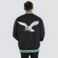 Philadelphia Eagles black satin varsity jacket with snap button closure and team logo.