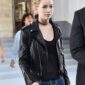 Jennifer Lawrence-inspired women’s Brando-style black leather biker jacket with asymmetrical zipper, lapel collar, and zippered pockets.