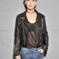 Jennifer Lawrence-inspired women’s Brando-style black leather biker jacket with asymmetrical zipper, lapel collar, and zippered pockets.