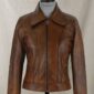 Selena Gomez-inspired Coach SS18 brown wax real leather jacket with front zipper closure and zipper pockets.