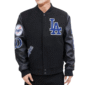 black Los Angeles Dodgers varsity jacket featuring wool body, leather sleeves, and embroidered team logos and patches.