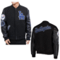 black Los Angeles Dodgers varsity jacket featuring wool body, leather sleeves, and embroidered team logos and patches.